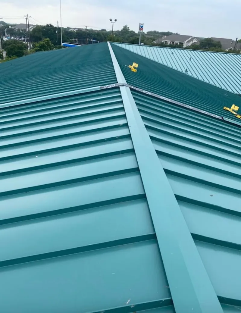 Green commercial metal roof ridge and valley for Metal Roof Repair in Oneonta